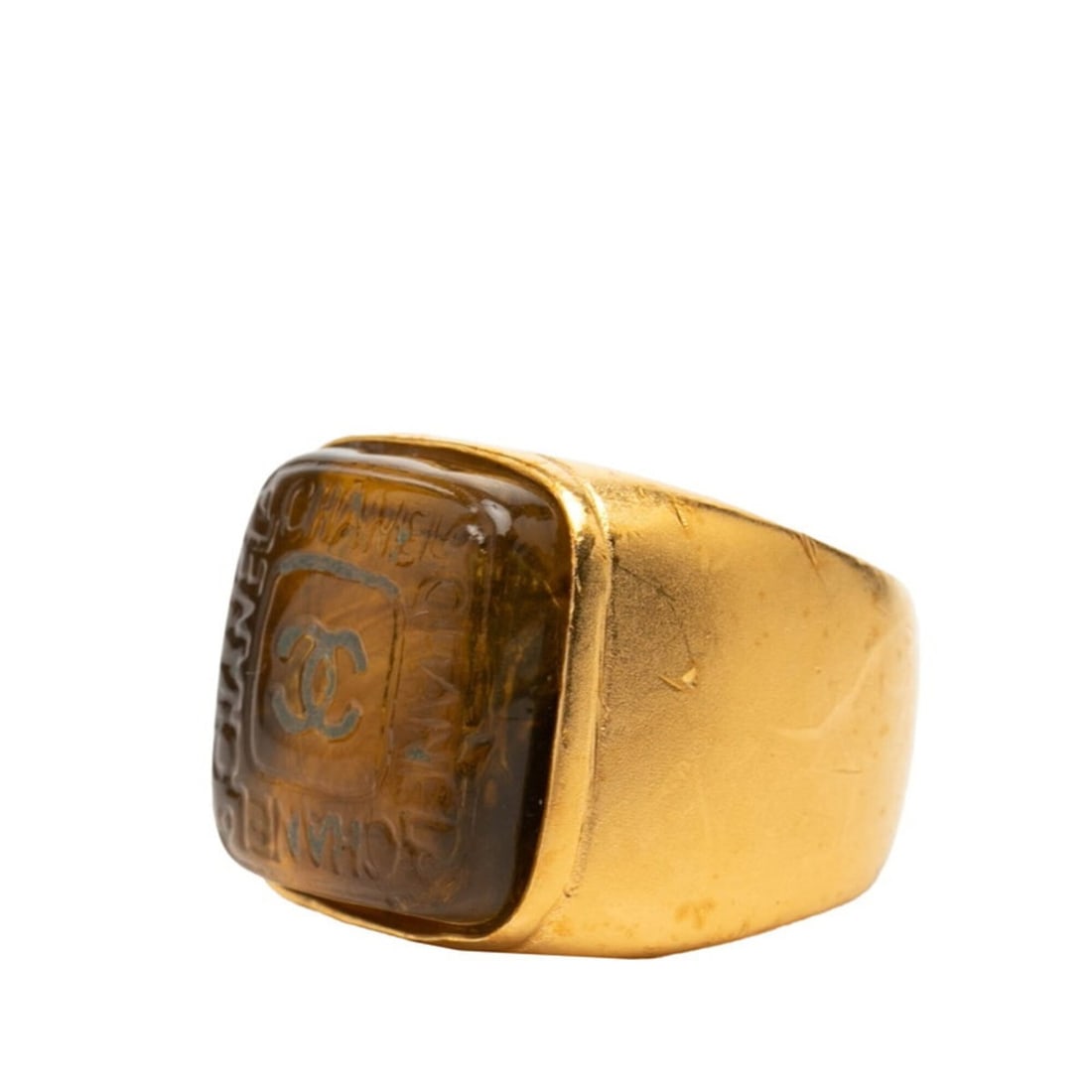 Chanel Coco Mark Gripoix Ring, Gold Plated Glass Women's CHANEL: --- Catalog ---Category: SizeJP Size: 10US Size: 5.5Category: DesignType: Band ringColor: GoldGender: WomenMaterial: GlassCategory: GeneralBrand: Chanel--- Item List ---Section: ConditionRanking: Rank