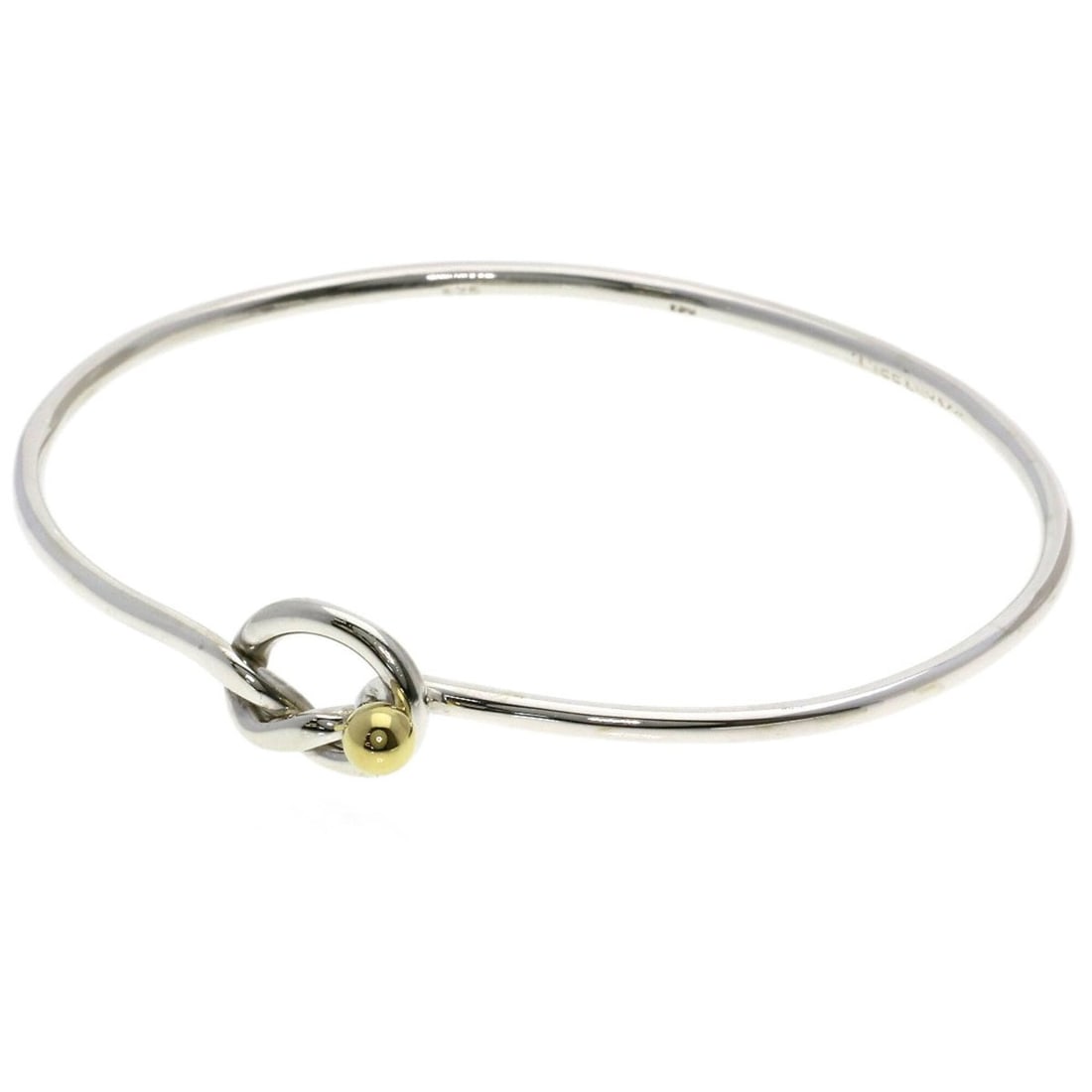 Tiffany & Co. Love Knot Bracelet, Silver/18K Yellow Gold, Women's.: --- Catalog ---Category: SizeLength: 16cm / 6.29''Category: DesignType: Charm braceletColor: Silver, Yellow goldGender: WomenMaterial: Silver, Yellow gold (18K)Category: GeneralBrand: Tiffany--- Item 