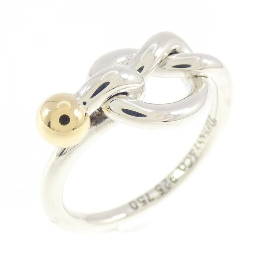Tiffany Love Knot Ring: --- Catalog ---Category: SizeJP Size: 7.0US Size: 4Category: DesignType: Band ringGender: WomenMaterial: Silver 925, Yellow gold (18K)Category: GeneralBrand: Tiffany--- Item List ---Section: Condition