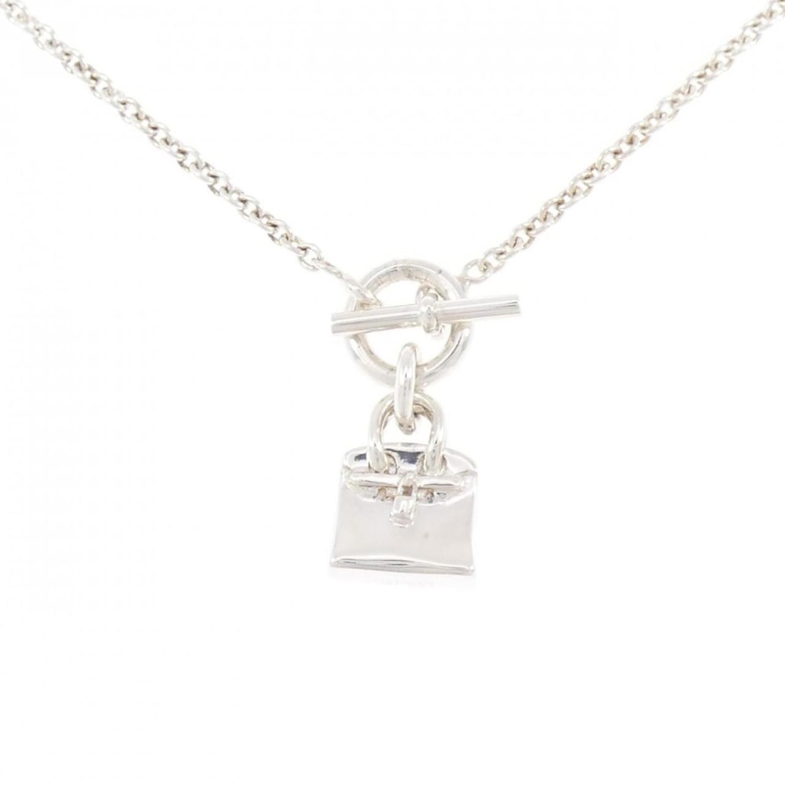 Hermes Amulette Birkin Necklace: --- Catalog ---Category: SizePendant Size: 28.4mm x 11.9mm / 1.11'' x 0.46''Neck Circumference: 39 cm / 15.35''Category: DesignGender: WomenMaterial: Silver 925Necklace Type: NecklaceCategory: