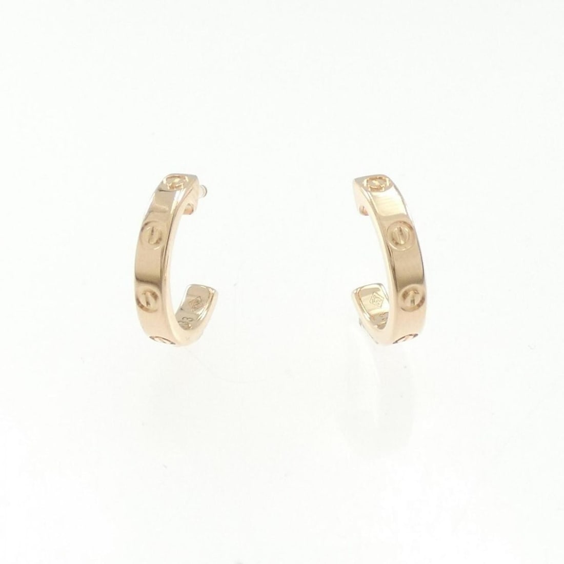 Cartier Mini Love Earrings: --- Catalog ---Category: SizeSize (HxWxD): 12.70mm x 2.50mm / 0.50'' x 0.10''Category: DesignType: Half hoop earringsColor: Pink goldGender: WomenMaterial: Pink gold (18K)Category: GeneralBrand: