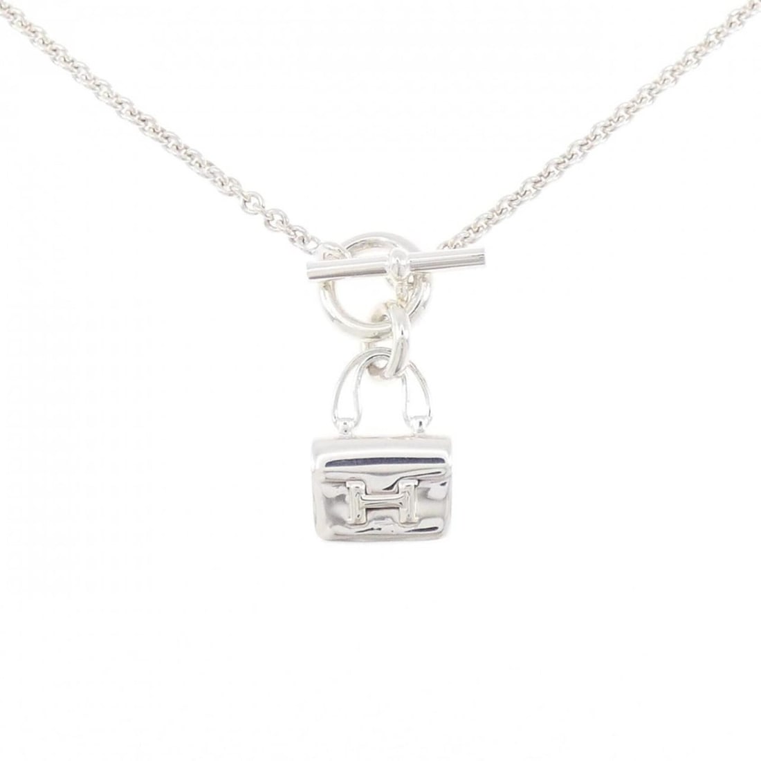 Hermes Amulette Constance Necklace: --- Catalog ---Category: SizePendant Size: 30.1mm x 12.7mm / 1.18'' x 0.49''Neck Circumference: 41 cm / 16.14''Category: DesignGender: WomenMaterial: Silver 925Necklace Type: NecklaceCategory: