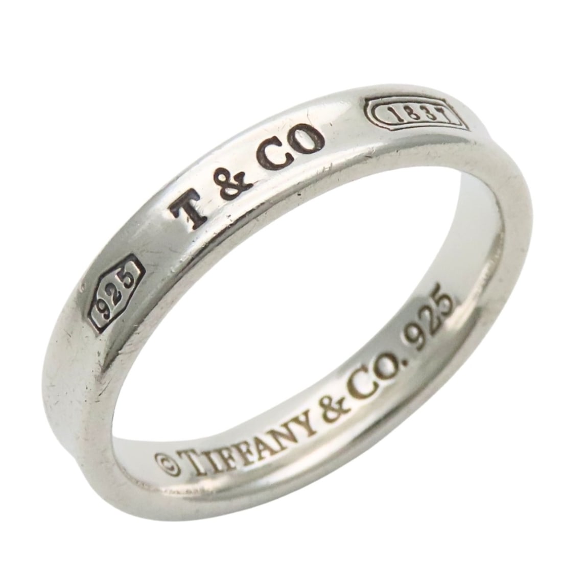 Tiffany & Co. 1837 Narrow Ring, Sterling Silver 925, Approx. 4.5g, Women's.: --- Catalog ---Category: SizeJP Size: 18.5US Size: 9Category: DesignType: Band ringColor: SilverGender: WomenMaterial: Silver 925Category: GeneralBrand: Tiffany--- Item List ---Section: ConditionRanki