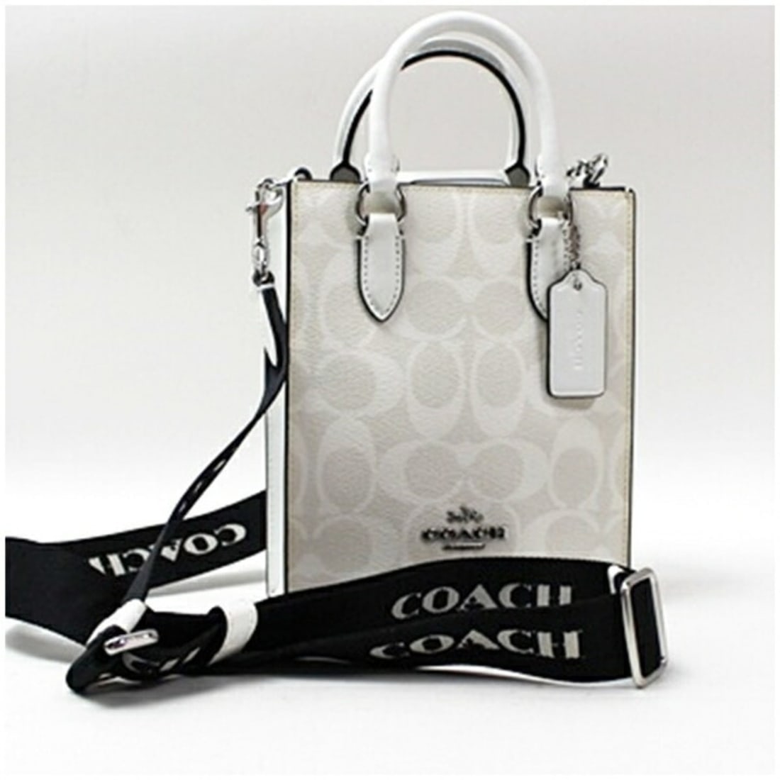 Coach North-South Mini Tote Bag, Leather, White, COACH Women's: --- Catalog ---Category: SizeSize (HxWxD): 17cm x 14cm x 5cm / 6.69'' x 5.51'' x 1.96''Category: DesignType: Shoulder bag, Tote bagColor: Beige, Black, Light gray, WhiteGender: WomenMaterial: Leather