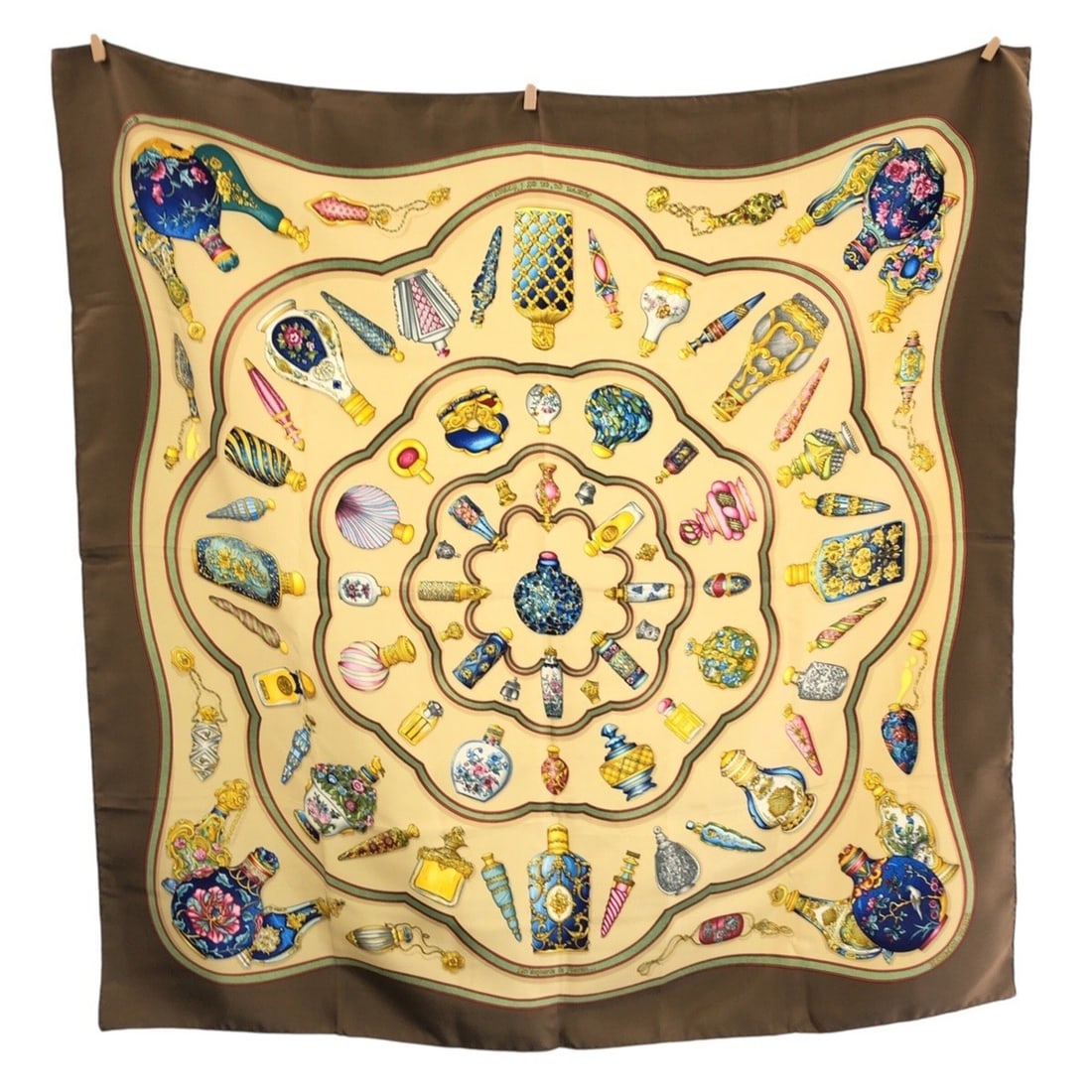 HERMES Perfume Bottle Carre 90 Beige Khaki Multicolor Silk Scarf/Muffler for Women: --- Catalog ---Category: SizeSize (LxW): 88cm x 88cm / 34.64'' x 34.64''Category: DesignType: ScarfColor: Beige, Khaki, Multi-colorGender: WomenMaterial: Silk Category: GeneralBrand: HermesCountry of 