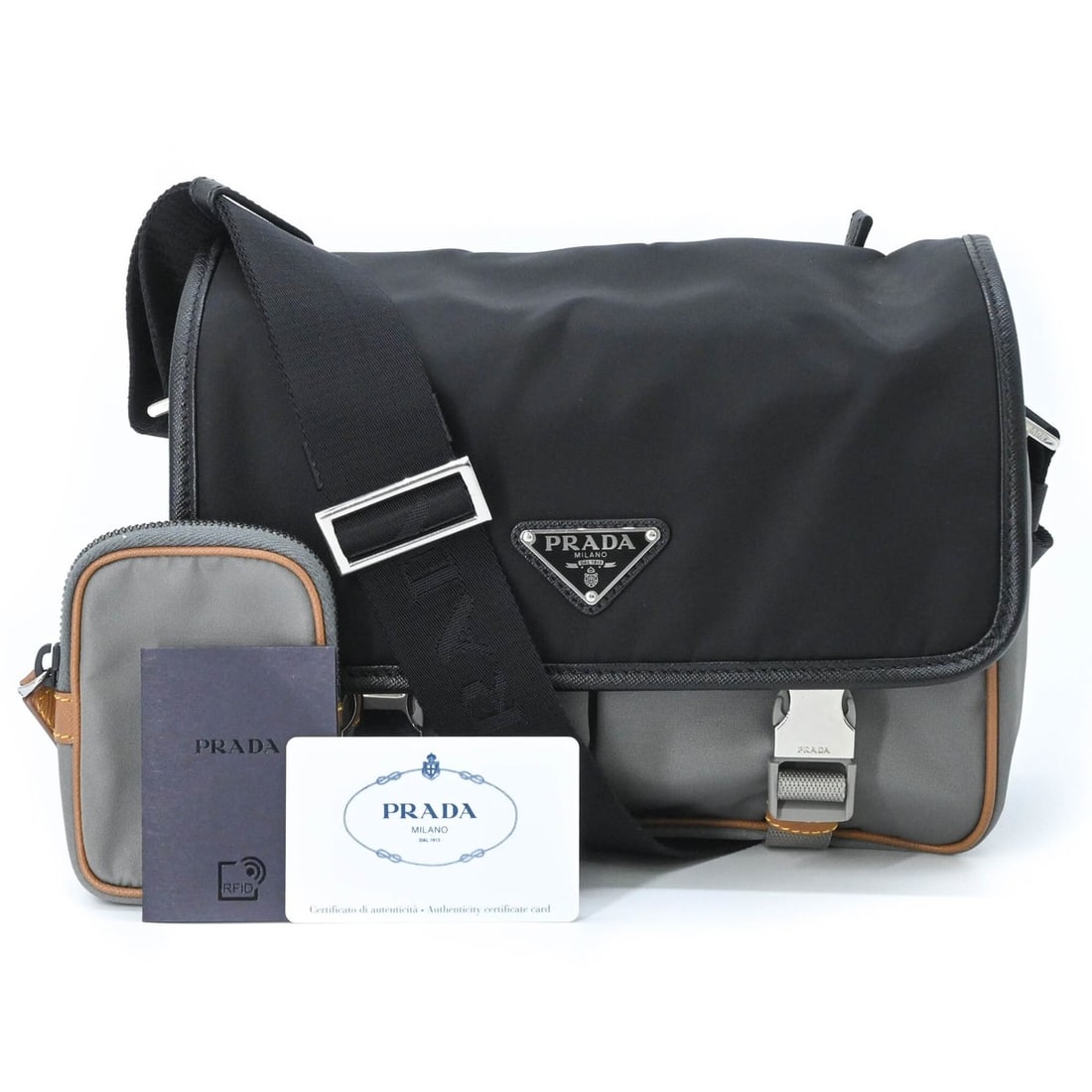 PRADA Tessuto Re-Nylon Triangle Shoulder Bag, Black, Gray, Brown, 2VD769: --- Catalog ---Category: SizeSize (HxWxD): 20cm x 26cm x 10cm / 7.87'' x 10.23'' x 3.93''Category: DesignType: Shoulder bagColor: Black, Gray brownGender: Women,MenMaterial: Nylon , Leather Category: 