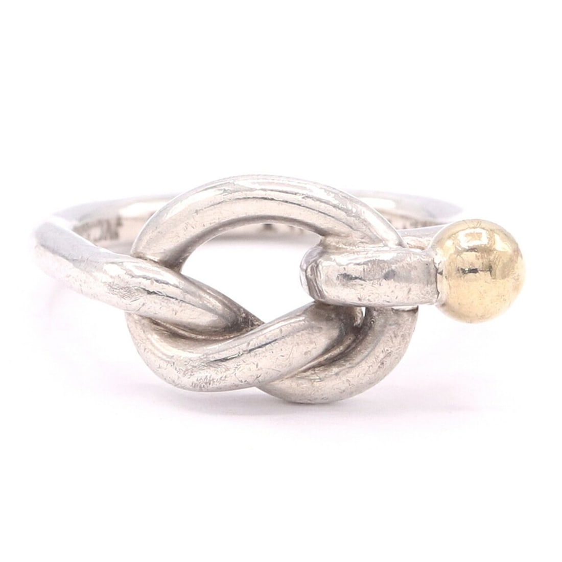 Tiffany & Co. Love Knot Ring, Sterling Silver 925 and 18K Yellow Gold Combination, Women's Ring.: --- Catalog ---Category: SizeJP Size: 6US Size: 3.5Category: DesignType: Band ringGender: WomenMaterial: Sterling silver 925, Yellow gold (18K)Category: GeneralBrand: Tiffany--- Item List ---Section: 