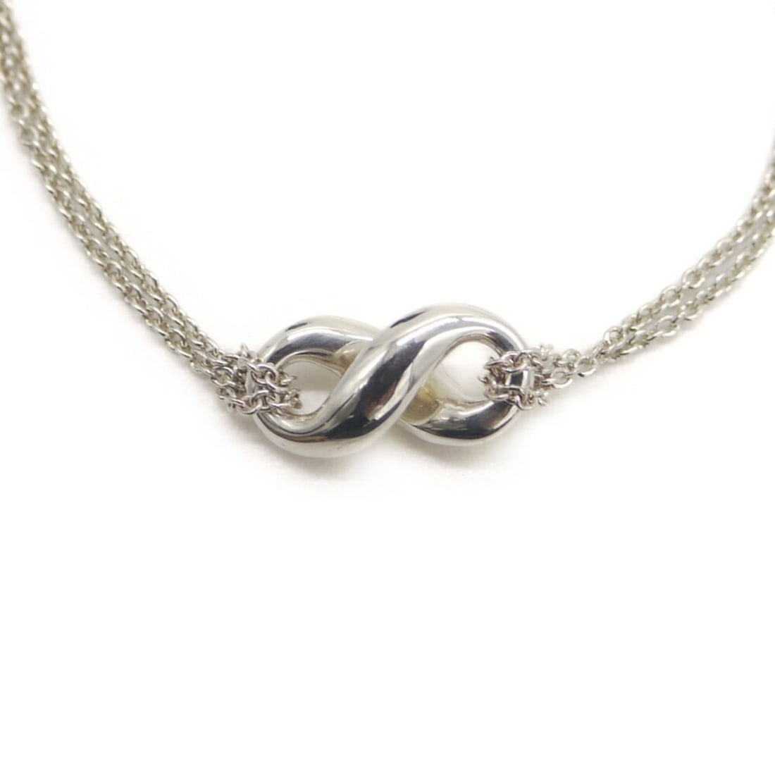 TIFFANY & Co. Tiffany Infinity Pendant Double Chain Necklace, Sterling Silver 925, Figaro: --- Catalog ---Category: SizePendant Size: 9.3mm x 18.6mm / 0.36'' x 0.73''Neck Circumference: 41 cm / 16.14''Category: DesignColor: SilverGender: WomenMaterial: Silver 925Necklace Type: