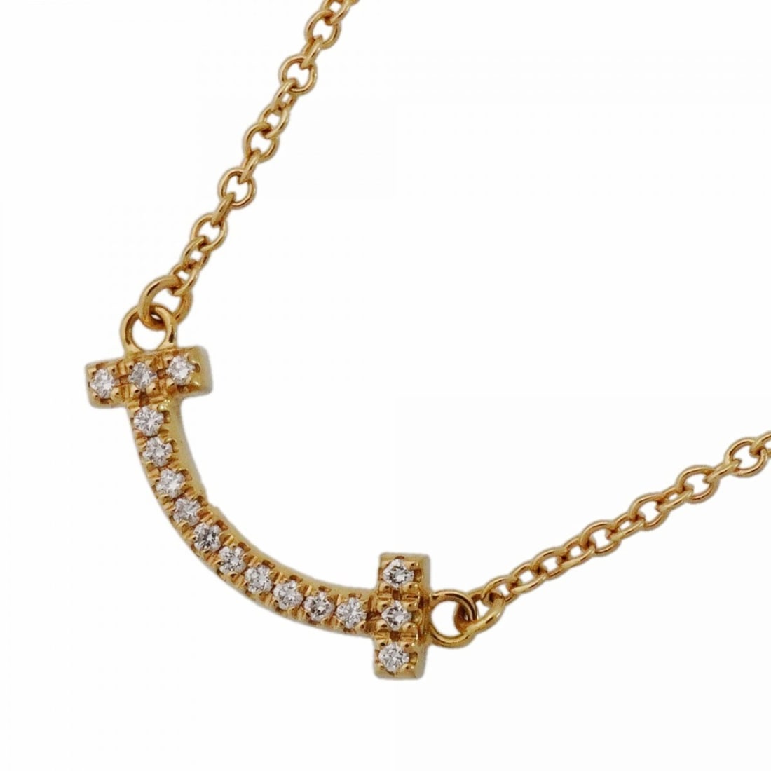 Tiffany & Co. T Smile Mini Necklace, 18K Yellow Gold, Diamond, Women's: --- Catalog ---Category: SizePendant Size: 4.6mm x 14.1mm / 0.18'' x 0.55''Neck Circumference: 41 cm - 46 cm / 16.14'' - 18.11''Category: DesignStone: DiamondGender: WomenMaterial: Yellow gold (18K)Ne