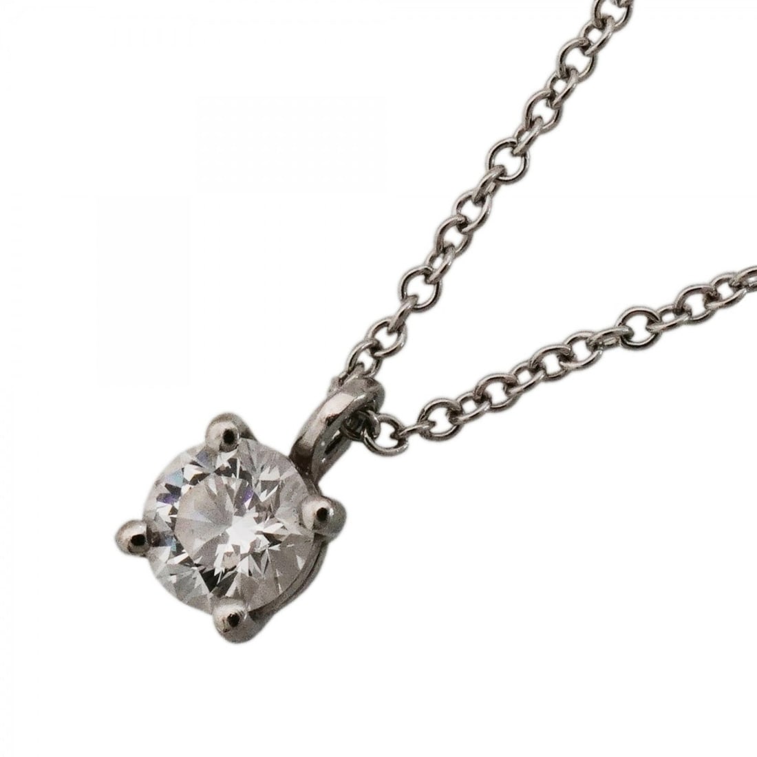 Tiffany & Co. Solitaire Necklace, 1PD (One Diamond), Platinum 950, Ladies': --- Catalog ---Category: SizePendant Size: 7.1mm x 4.3mm / 0.27'' x 0.16''Neck Circumference: 41 cm / 16.14''Category: DesignStone: DiamondGender: WomenMaterial: Platinum 950Necklace Type: NecklaceCat