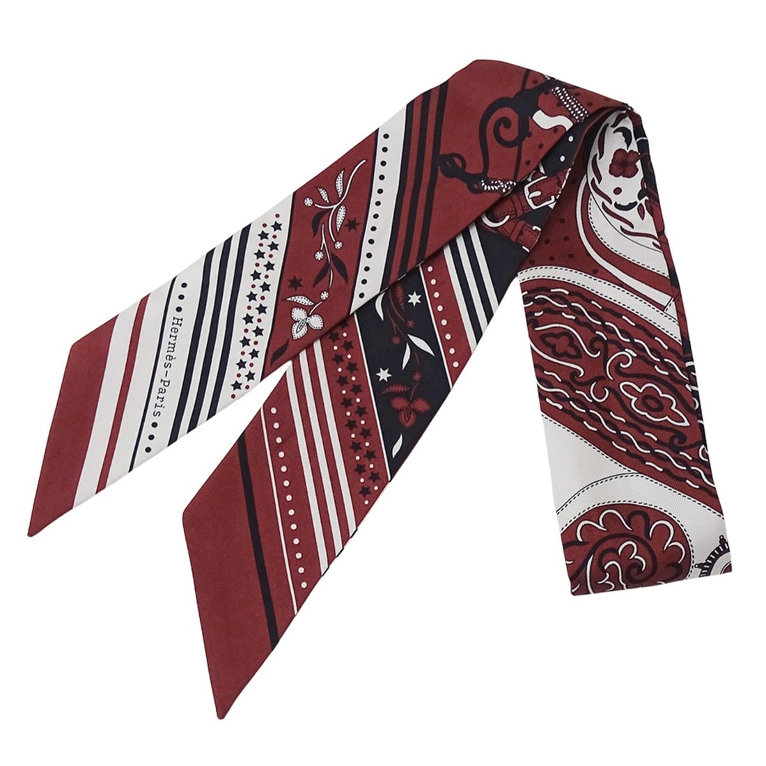 Hermes scarf/muffler for women, brand name Twilly, Festival Des Amazones, silk, Burgundy/Bordeaux.: --- Catalog ---Category: SizeSize (LxW): 5cm x 85.5cm / 1.96'' x 33.66''Category: DesignType: ScarfColor: BordeauxGender: WomenMaterial: Silk Category: GeneralBrand: HermesCountry of Origin: France---
