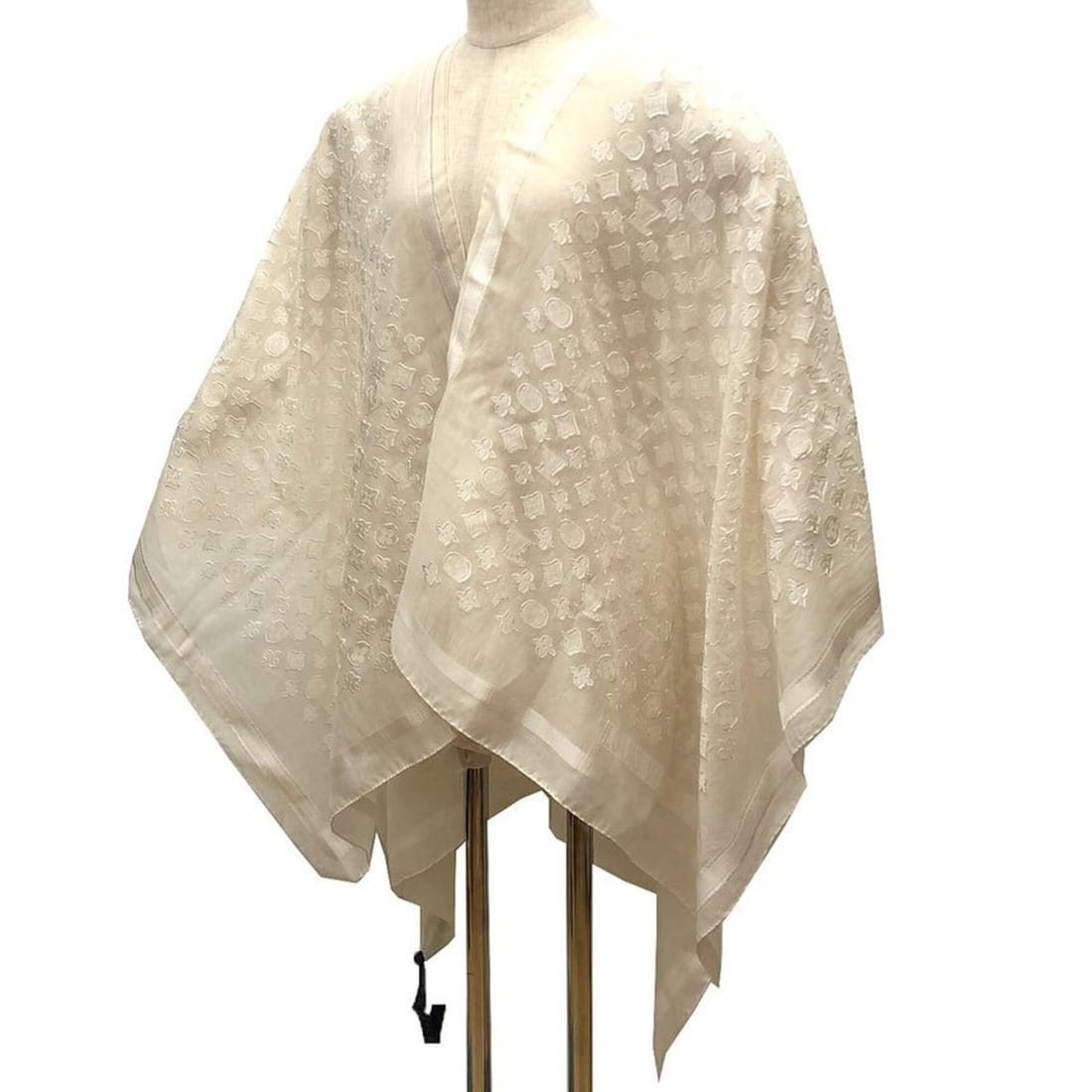 LOUIS VUITTON Monogram Poncho Stole, Ivory White Silk Cotton Women's Scarf/Muffler: --- Catalog ---Category: SizeSize (LxW): 1.47m x 1.28m / 57.87'' x 50.39''Category: DesignType: StoleColor: Ivory, WhiteGender: WomenMaterial: Silk , Cotton , Leather Category: GeneralBrand: Louis Vui