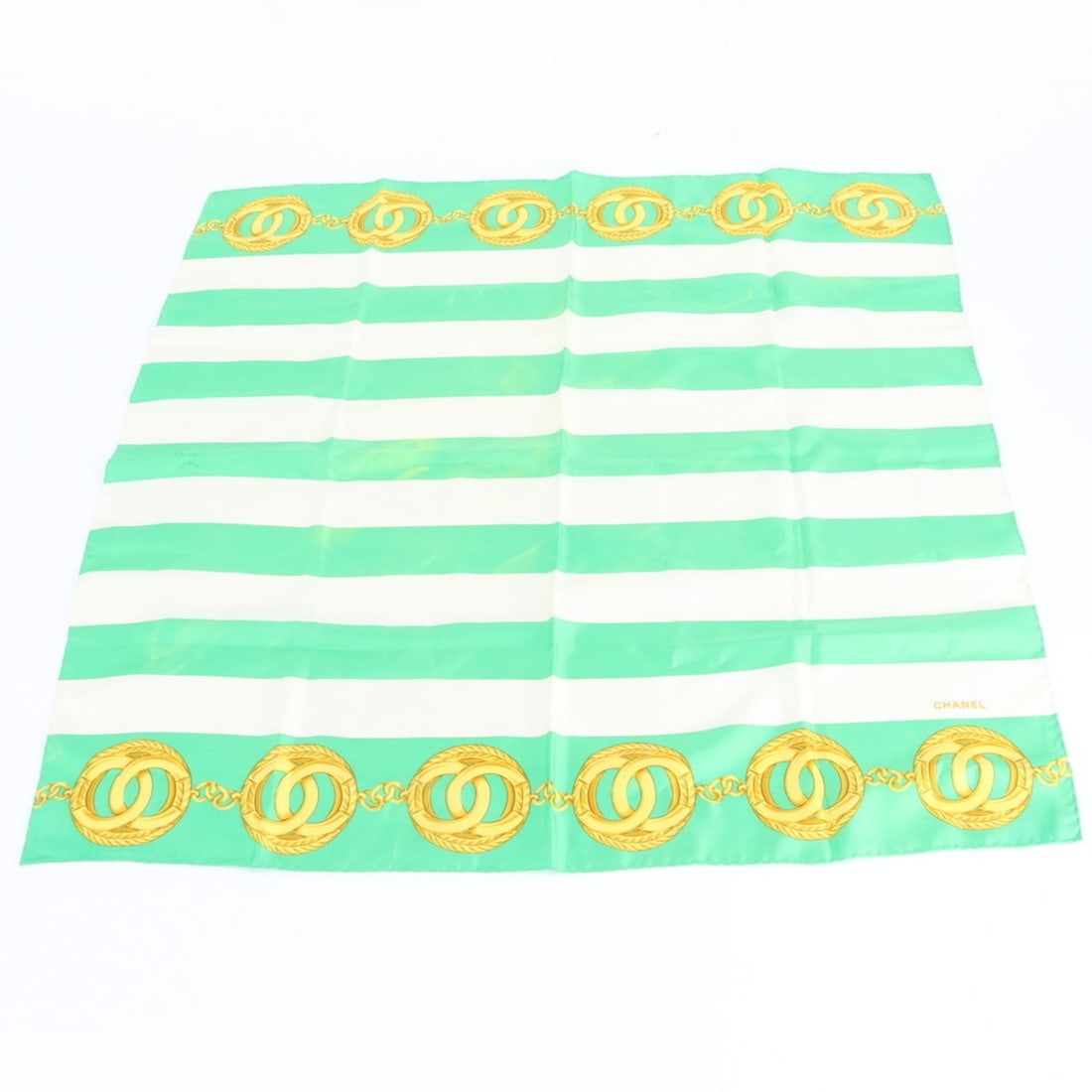 Chanel Gold Chain Coco Mark Stripe Scarf/Muffler Large Stole for Women: --- Catalog ---Category: SizeSize (LxW): 84cm x 84cm / 33.07'' x 33.07''Category: DesignType: ScarfColor: Green, WhiteGender: WomenCategory: GeneralBrand: Chanel--- Item List ---Section: ConditionRank