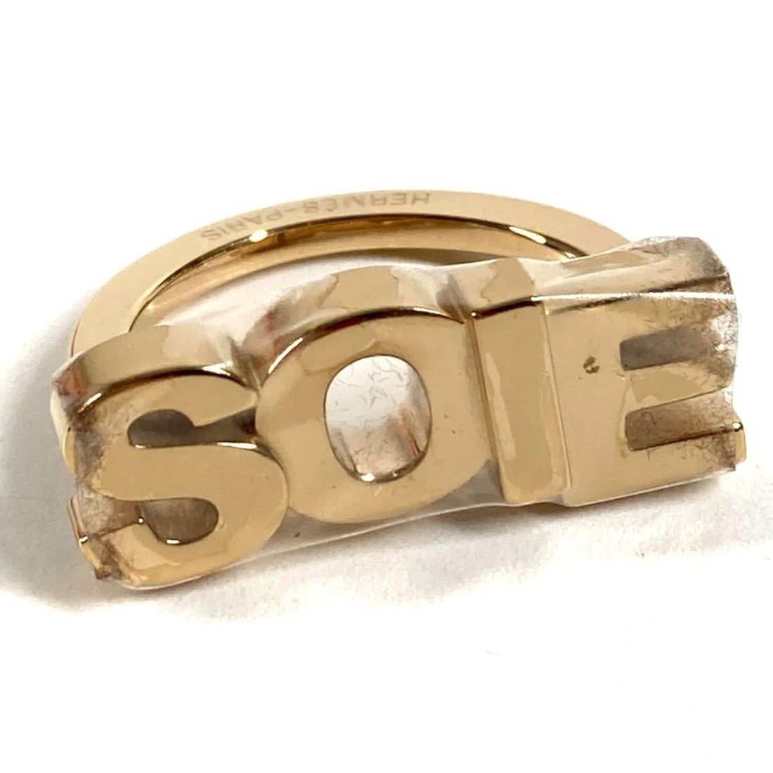 HERMES SOIE logo scarf, muffler, and ring in metal, gold, like new for men women.: --- Catalog ---Category: DesignType: Scarf ringColor: GoldGender: Men,WomenMaterial: Metal Category: GeneralBrand: HermesCountry of Origin: France--- Item List ---Section: ConditionRanking: Rank S Use