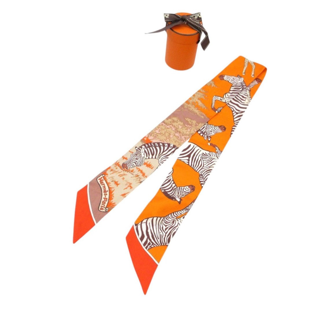 Like new Hermès Twilly Zebra Scarf/Muffler in Silk, Orange and Multicolor, 1359HERMES: --- Catalog ---Category: SizeSize (LxW): 86cm x 5cm / 33.85'' x 1.96''Category: DesignType: ScarfColor: Multi-color, OrangeGender: WomenMaterial: Silk Category: GeneralBrand: HermesCountry of Origin: 