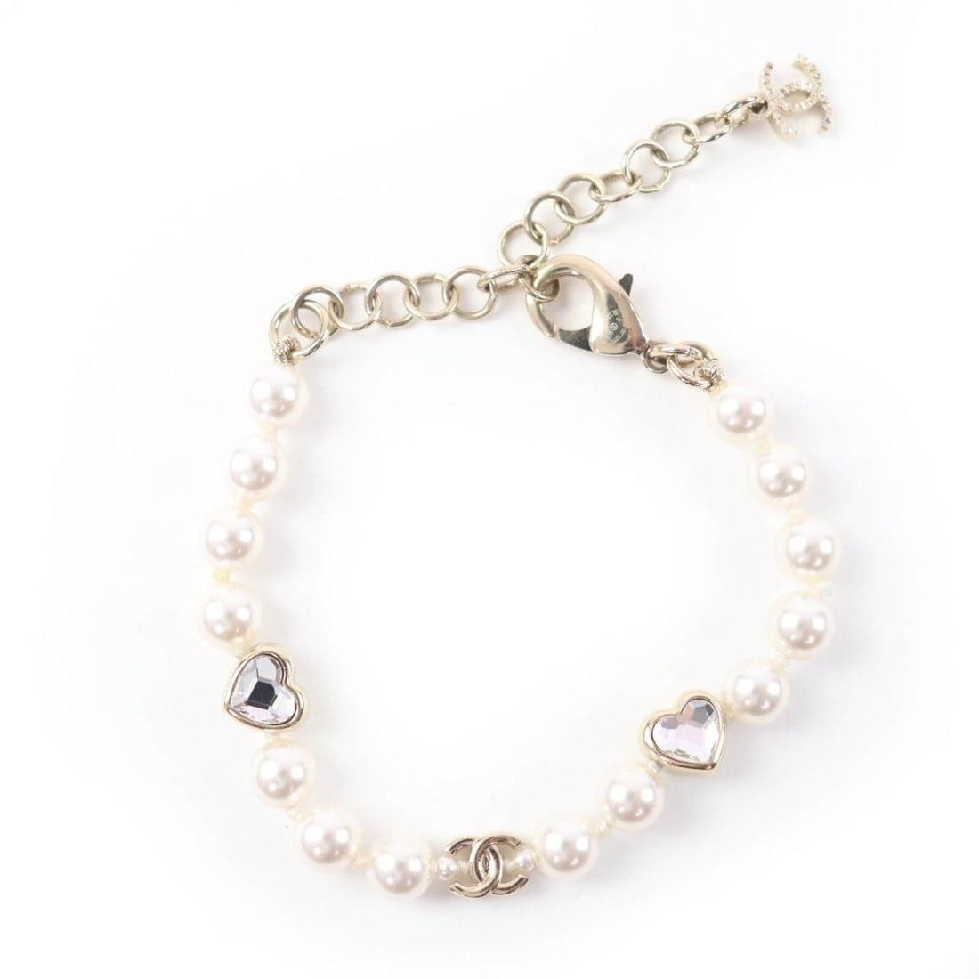 CHANEL B25B Coco Mark Heart Rhinestone Faux Pearl Bracelet, Gold, Made in Italy, Women's, with Box: --- Catalog ---Category: SizeLength: 14cm - 19cm / 5.51'' - 7.48''Category: DesignType: Charm braceletColor: GoldGender: WomenCategory: GeneralMPN: B25BBrand: ChanelCountry of Origin: Italy--- Item Li