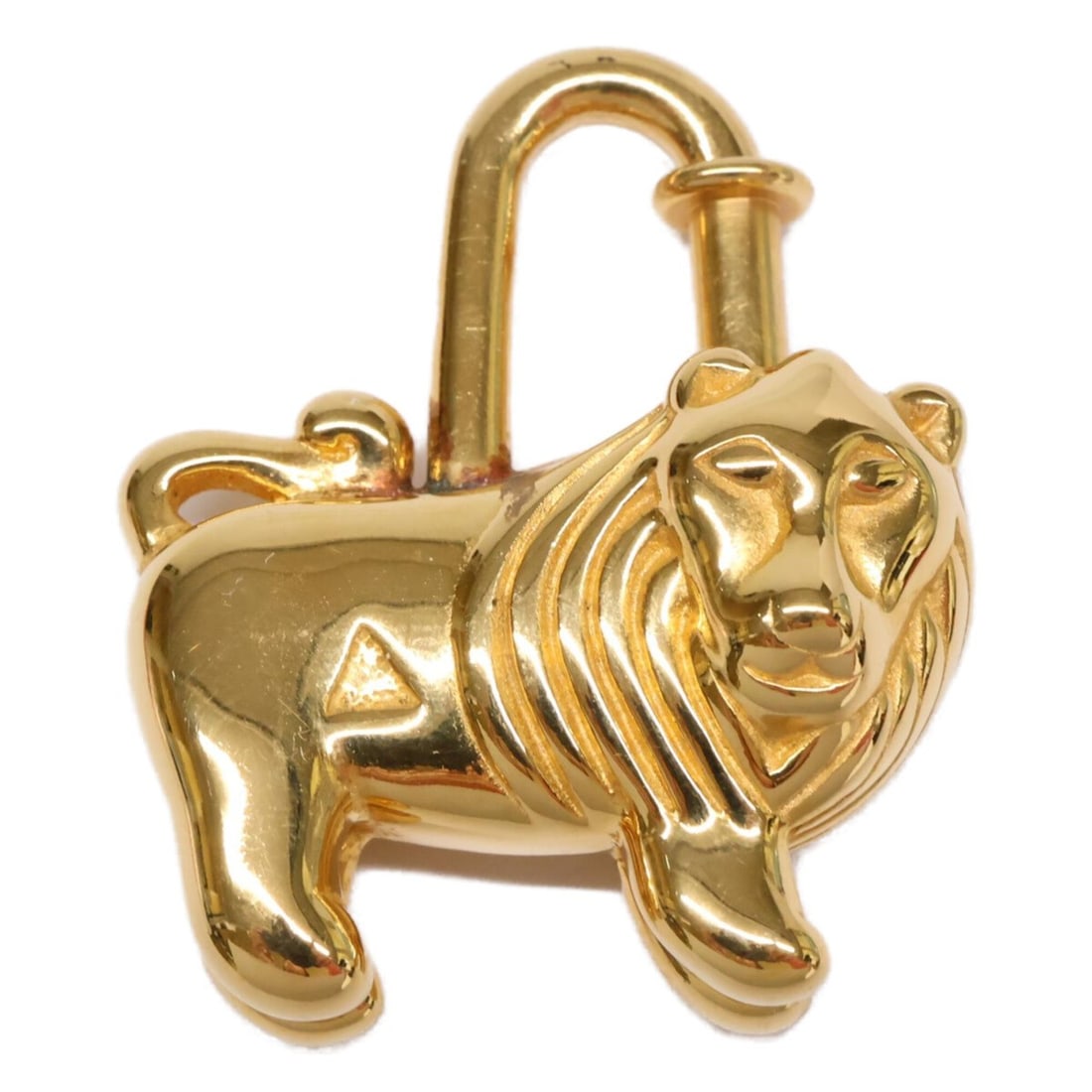 HERMES 1997 Limited Edition Lion Cadena Keychain Gold Women's: --- Catalog ---Category: SizeSize (HxWxD): 3.5cm x 2.9cm / 1.37'' x 1.14''Category: DesignType: KeyringColor: GoldGender: WomenMaterial: MetalCategory: GeneralBrand: Hermes--- Item List ---Section: Co