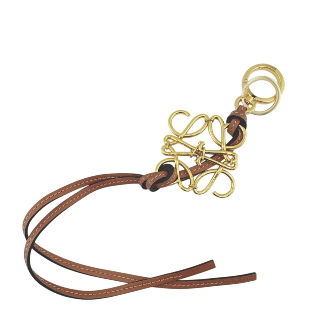 LOEWE Anagram Charm Bag Brown: --- Catalog ---Category: SizeSize (HxWxD): 420.00mm x 80.00mm / 16.54'' x 3.15''Category: DesignType: Handbag charmColor: Brown, GoldFinish: Gold platedGender: WomenCategory: GeneralBrand: Loewe--- It