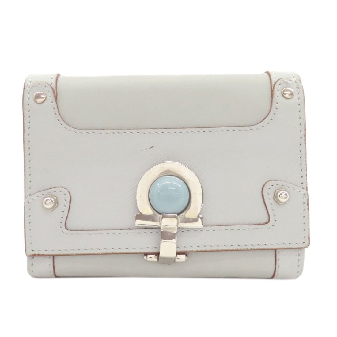 Salvatore Ferragamo Gancini hardware bi-fold leather wallet for women.: --- Catalog ---Category: SizeSize (HxWxD): 8cm x 10.5cm x 2.5cm / 3.14'' x 4.13'' x 0.98''Category: DesignType: Wallet (bi-fold)Color: Light blueGender: WomenMaterial: Leather Category: GeneralBrand: