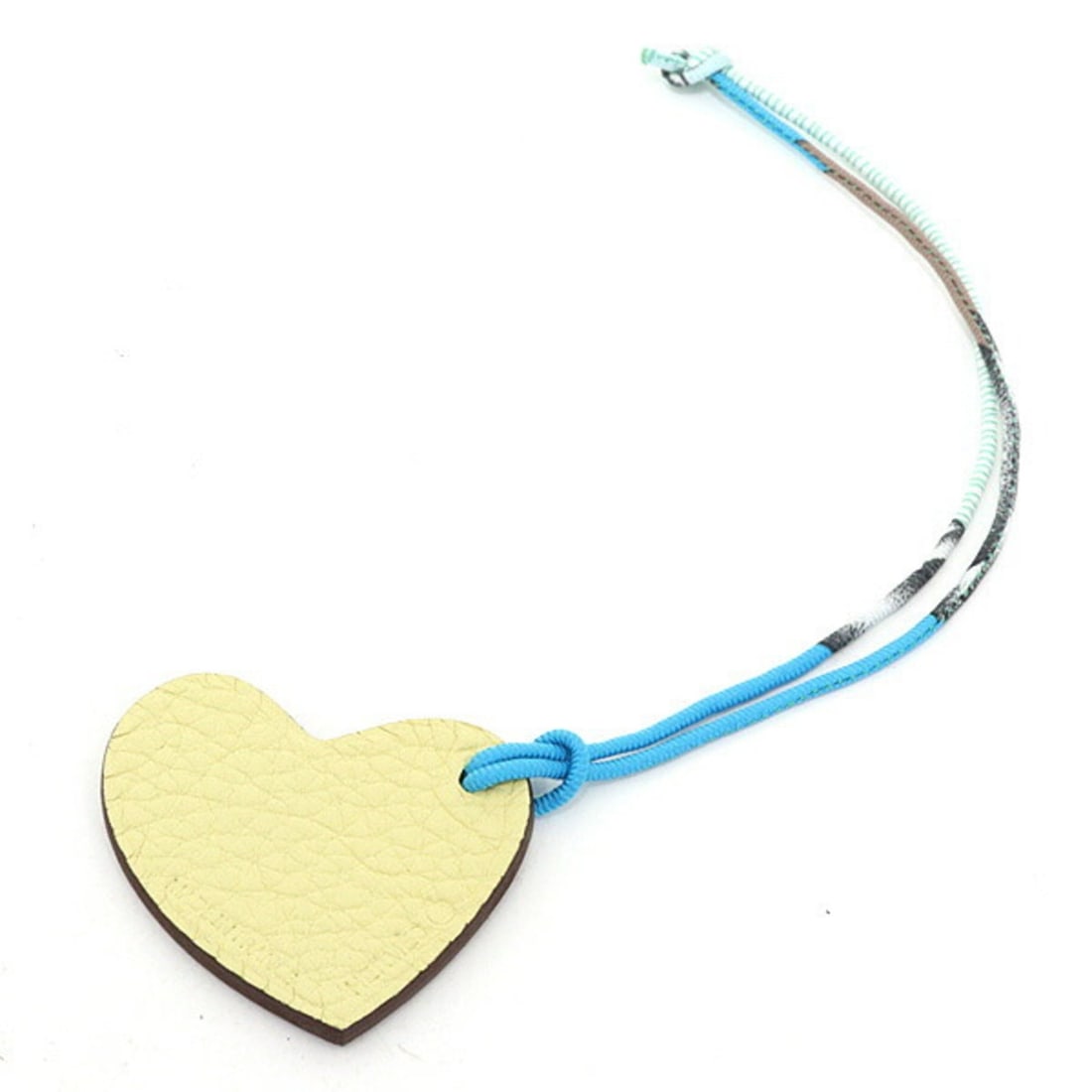 Hermes Petit h S Charm Heart Mini Cream Yellow/Mocha Brown Bag: --- Catalog ---Category: SizeSize (HxWxD): 4.20mm x 4.70mm / 0.17'' x 0.19''Category: DesignType: Handbag charmColor: Blue, Brown, Cream, Mocha, White, YellowGender: WomenMaterial: Epsom leather, Silk