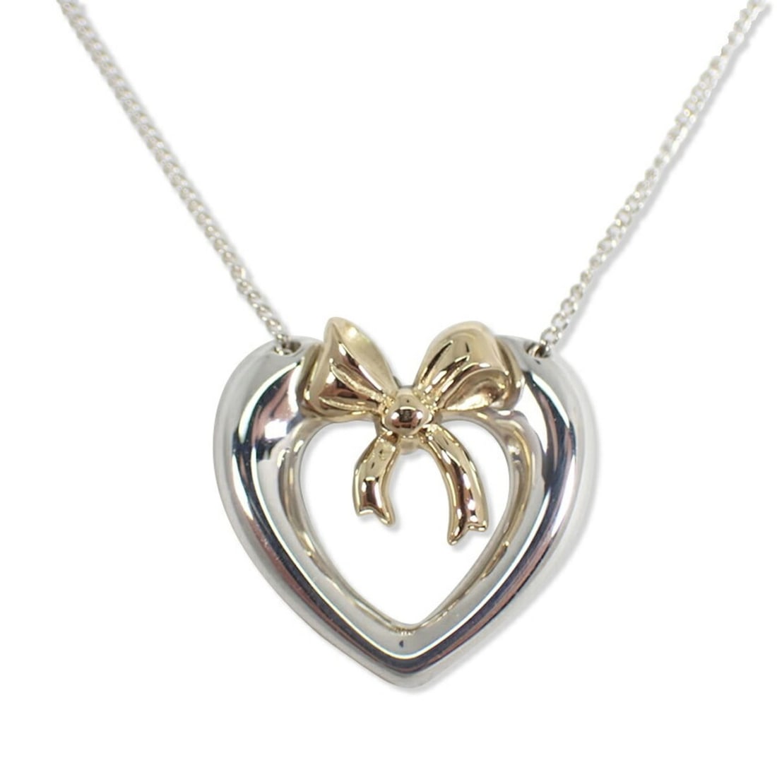 TIFFANY & Co. 925 750 Heart Ribbon Pendant Necklace: --- Catalog ---Category: SizePendant Size: 17.4mm x 18.1mm / 0.68'' x 0.71''Neck Circumference: 47.3 cm / 18.62''Category: DesignColor: Silver, Yellow goldGender: Women,MenMaterial: Sterling silver 92