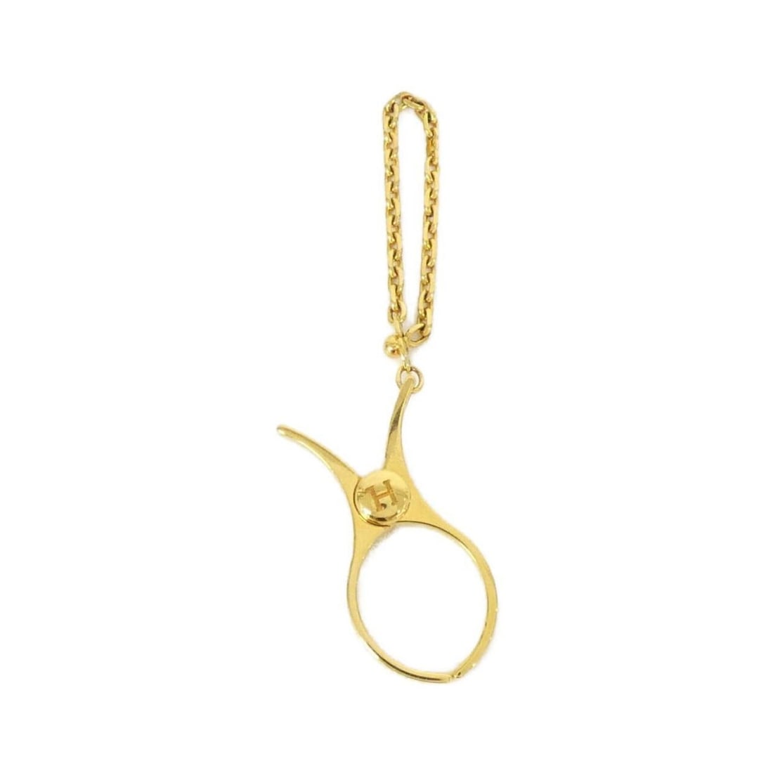 Hermes Philou Glove Holder 000833G: --- Catalog ---Category: DesignType: Glove holderColor: GoldGender: WomenCategory: GeneralBrand: Hermes--- Item List ---Section: ConditionRanking: Rank A Used - A few traces of usage, some scratches