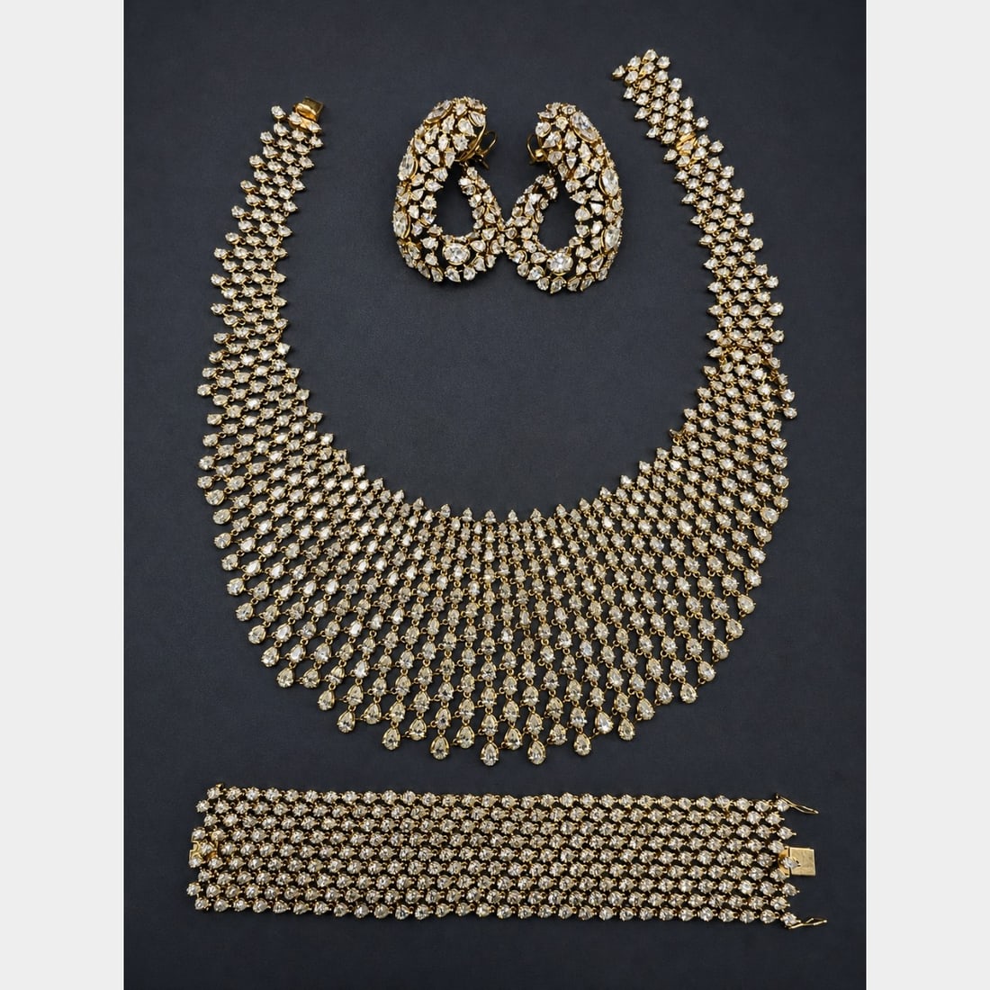 18K YG Diamond Suite: 18K Yellow Gold Matching Set: Necklace, Bracelet, and Earrings. Set with high-clarity round diamonds. Custom link design.