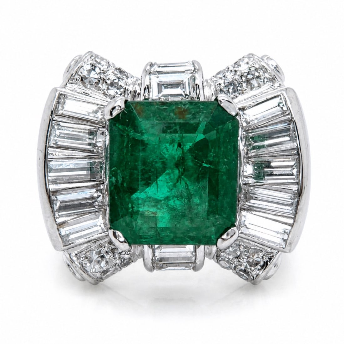 Art Deco Platinum Emerald Ring: Solid Platinum Art Deco mounting. Natural Emerald center with geometric diamond accents.
