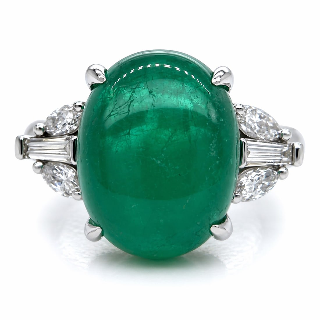 Platinum 5.94 Ct. Emerald & Diamond Ring: Solid Platinum; 5.94 Ct. Natural Emerald; Tapered diamond baguettes set in the shoulders.