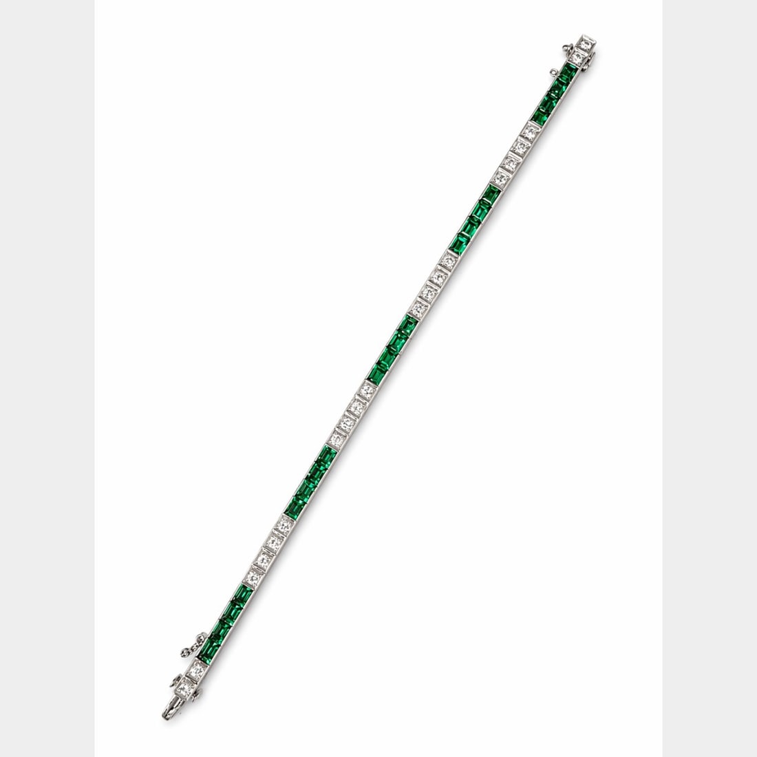 1960’s 14K WG Diamond & Emerald Bracelet: 1960s Vintage; 14K White Gold; Diamond links with synthetic emerald accents in a tennis style.
