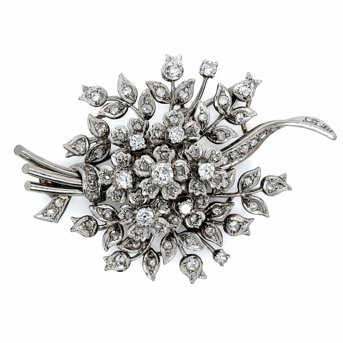 Retro Platinum 3.60 Ct. Diamond Brooch: Mid-century Retro design; Solid Platinum; 3.60 Ct. diamonds in a bold, geometric scroll.
