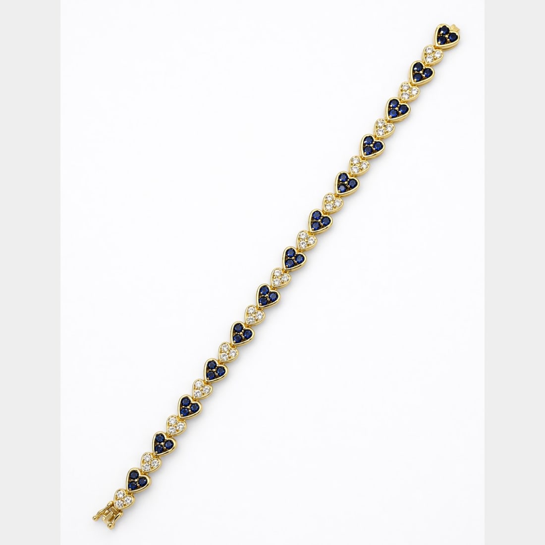 18K YG Diamond & Sapphire Heart Bracelet: 18K Yellow Gold; Heart-link design set with natural Sapphires and white Diamonds.
