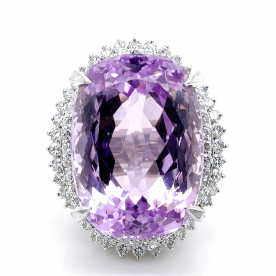 Platinum 31.99 Ct. Kunzite & Diamond Ring: Solid Platinum; Massive 31.99 Ct. Kunzite center; Flanked by brilliant white diamond side stones.