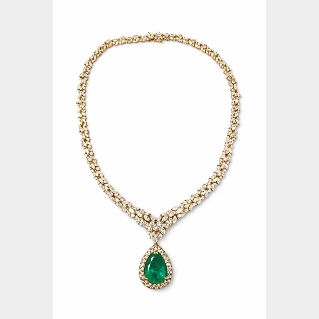 18K YG SSEF Colombian Emerald Day/Night Necklace: High Jewelry; 18K Yellow Gold; SSEF Certified natural Colombian Emerald with diamond halo; Convertible day/night style.