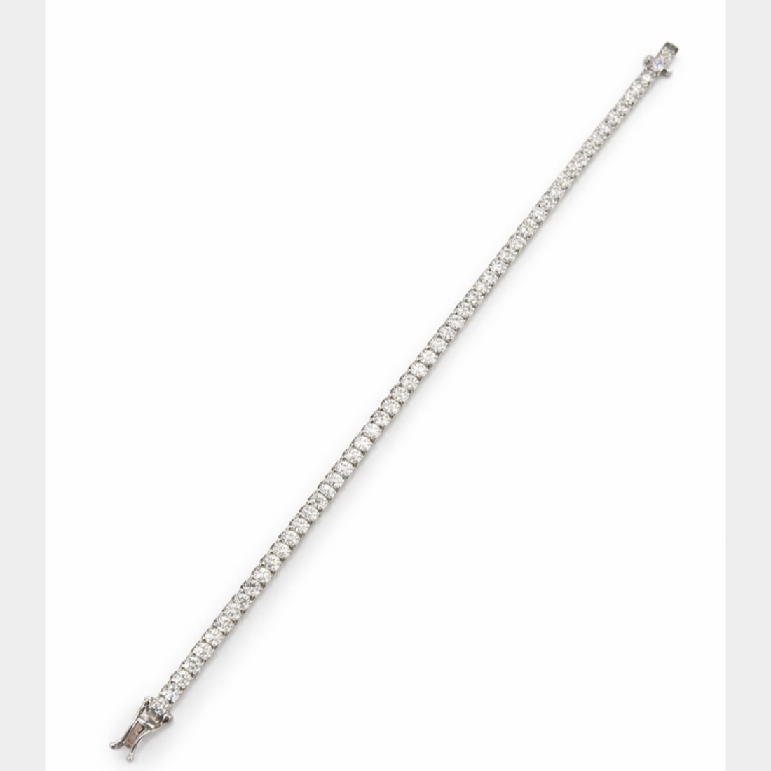 14K White Gold 7.90 Ct. Diamond Bracelet: 14K White Gold straight-line tennis style; Matched white diamonds totaling 7.90 Ct.