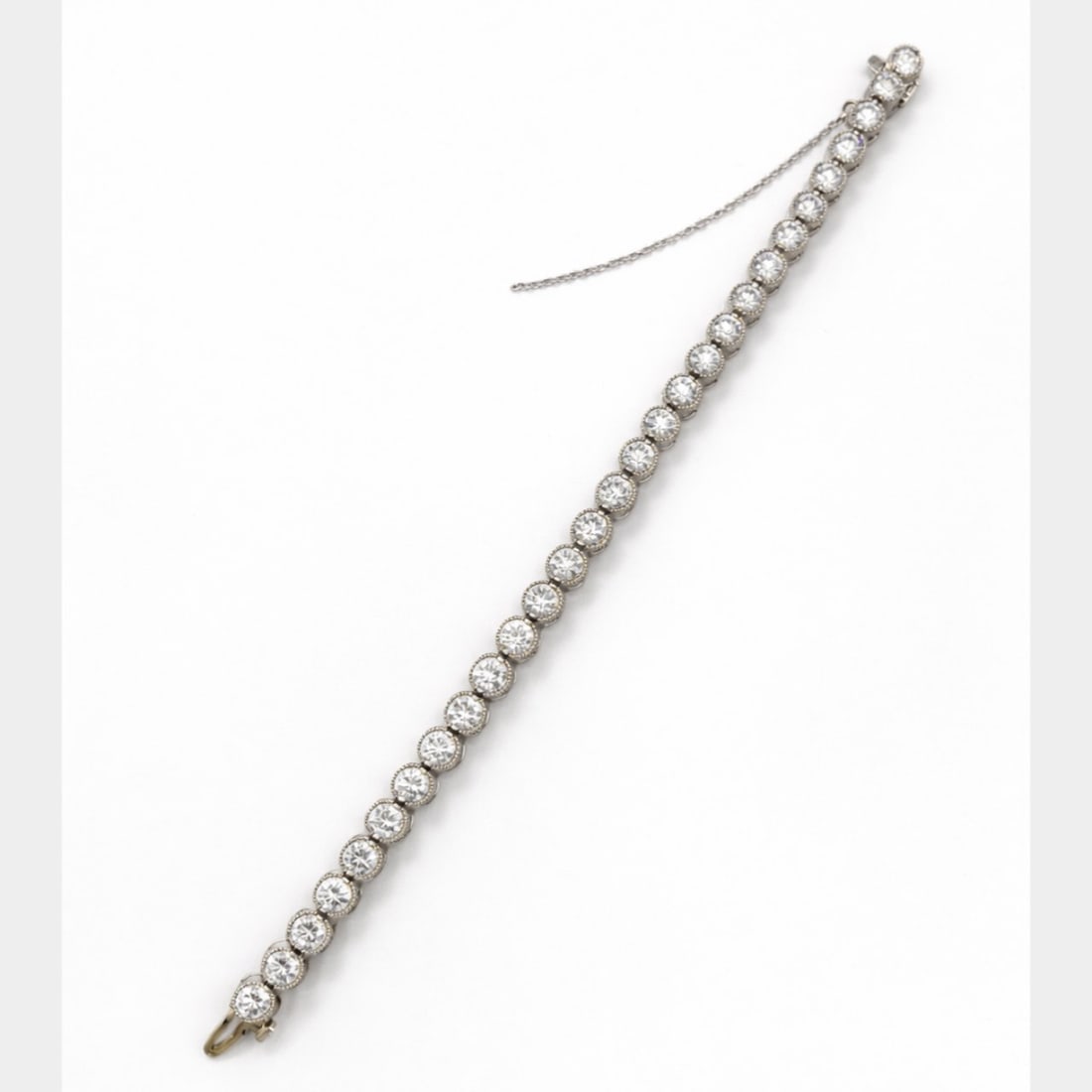 Platinum 9.25 Ct. Diamond Tennis Bracelet: Solid Platinum heavy mounting; 9.25 Ct. total weight of premium matched round brilliant diamonds.