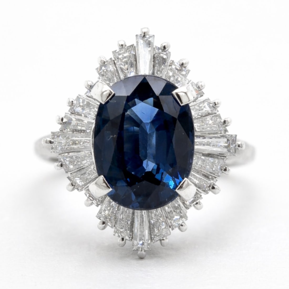 Platinum 2.39 Ct. Sapphire & Diamond Ring: Solid Platinum; 2.39 Ct. natural Blue Sapphire center framed by clean diamond side stones.