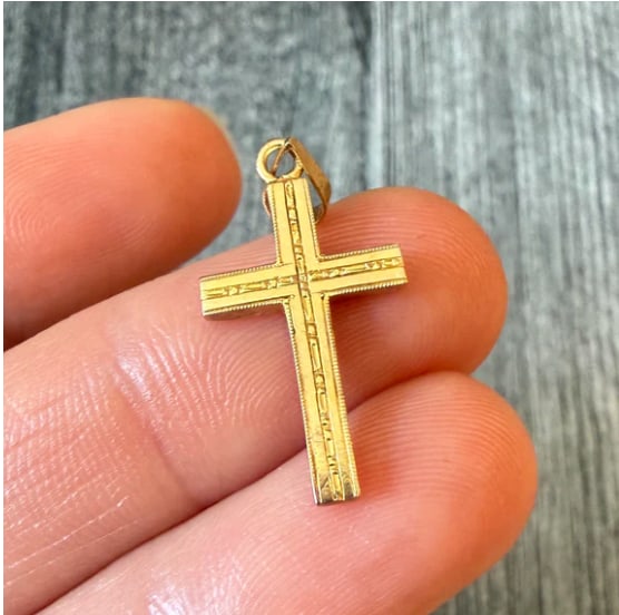 Vintage 14K Gold Chased Cross Charm: Elegant, classic Latin cross pendant adorned with traditional hand-engraved chased foliate patterns along the front surface. Highly reflective polished borders. Measures 24 mm long x 14 mm wide. Weigh