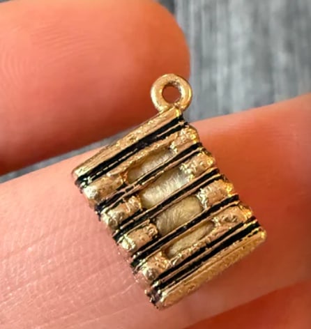 Vintage Enamel and 14K Gold Haystack Charm: A detailed 3D vintage charm shaped like a classic haystack with textured gold work and fine green enamel detailing at the base. Measures 14 mm x 12 mm. Weight: 1.8 grams.