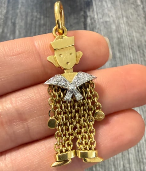 Pomellato Diamond and 18K Gold Chain Sailor Charm: Authentic designer piece by Pomellato. A stylized jointed stick-figure sailor or mariner charm with moving arms and legs, dangling from a chunky marine-link accent loop encrusted with brilliant cut wh