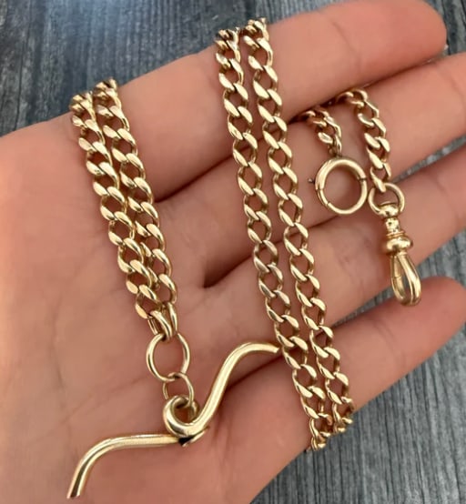 Art Deco 14K Gold Curb Link Watch Chain with T-Bar, 23" Long: Exceptional antique pocket watch chain repurposed as a dramatic long necklace or wrap bracelet. Composed of tight, uniform, hand-soldered graduated curb links terminating in a traditional swiveling do
