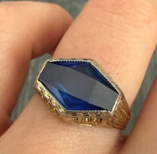 Art Deco Fancy Cut Synthetic Sapphire and 14K Gold Ring (S): True 1930s period ring featuring an elongated geometric step-cut synthetic blue sapphire (approx 2.50 cts) in a beautifully crisp 14K white gold filigree setting with orange blossom engraved