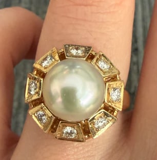 South Sea Pearl and Diamond Ring in 14K Gold (S): Elegant mid-century cocktail ring featuring a large, high-luster 9.5 mm creamy white South Sea cultured pearl flanked by 4 bright marquise-cut white diamonds (approx. 0.18 ctw) in a fluid bypass setti