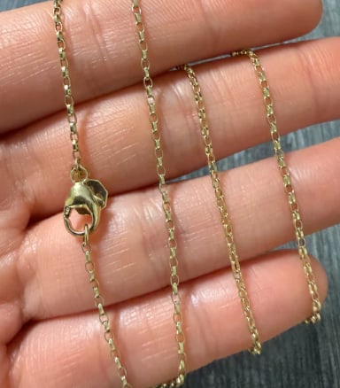 14K Gold Cable Link Chain, 16" Long: Solid, sturdy round cable link necklace chain with uniform diamond-cut links for added brilliance. Complete with a heavy teardrop lobster clasp. Link thickness: 2.2 mm. Length: 16.0 inches. Weight: 5.