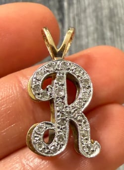 Diamond and 14K Gold Initial "R" Charm: Modern uppercase alphabet letter "R" block-style pendant completely pave-set along the front face with bright single-cut white accent diamonds (approx. 0.15 ctw). Dimensions: 14 mm x 11 mm. Weight: 1.