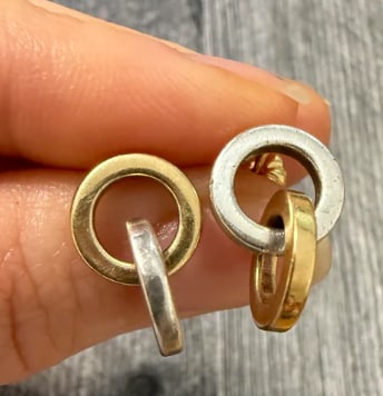 Tiffany & Co Interlocking Circle Link Dangle Earrings in Silver and 18K Gold: Authentic archived designer pieces by Tiffany & Co. Bold drop configuration composed of interlocking circular rings combining a heavy solid sterling silver base link with thick, contrasting solid 18K 