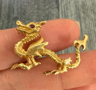 Handmade 18K Gold Dragon Pendant: Masterfully hand-wrought three-dimensional Chinese imperial dragon pendant cast in high-purity 18K yellow gold. Features intricate, individually carved scales, a fluidly winding body, and tiny bezel-s