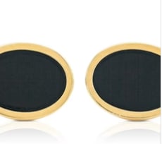 Tiffany & Co. 18k Gold Cufflinks with Black Onyx Center: Iconic designer estate men's jewelry signed Tiffany & Co. Double-faced heavy 18K yellow gold structural frames housing flush-set, highly polished circular black onyx stone plaques. Face diameter: 14 m