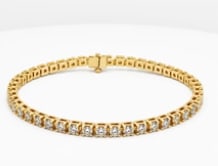 14k Diamond Tennis Bracelet: Essential low-profile four-prong tennis bracelet in polished 14K yellow gold, meticulously set with a single row of matching round brilliant white diamonds (approx. 2.25 ctw). Length: 7.0 inches. Weig