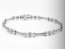 14k Diamond Bracelet: Heavy-set unisex classic 14K white gold openwork geometric line link bracelet, highlighted by bezel-set transitional round diamonds alternated with satin-finished structural links. Length: 7.5